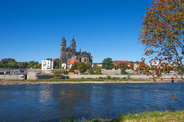 Fototapeta na wymiar Old Cathedral and river Elba in Magdeburg, Autumn