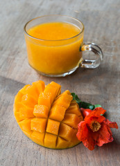 Mango and juice in a glass mug