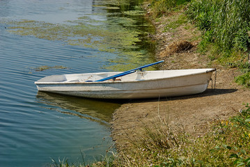 Boat on the lake, pond.