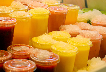 smoothies in plastic cups with ice