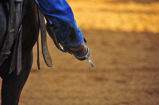 Rider foot in the stirrup