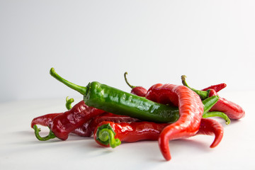 hot peppers on a white background 