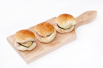 Hamburger sandwiches with ham and cucumber