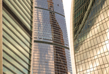 Glass walls of the building Moscow City with reflections. A lot