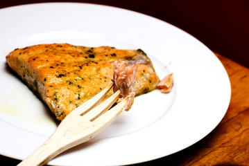 Grilled salmon on a white plate