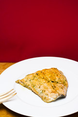 Grilled salmon on a white plate