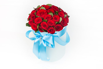gift deluxe bucket of red roses on white background