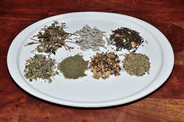 Piles of tea on teak surface