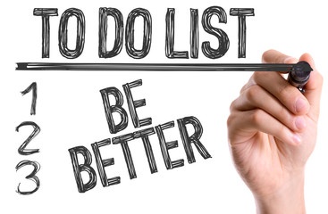 Hand with marker writing: To Do List: Be Better