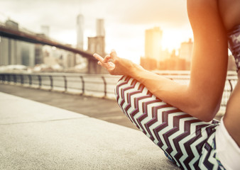 woman making yoga position in New york city.