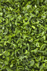 Chopped scallion leaves background. Top view of lots of chopped scallion leaves. 
