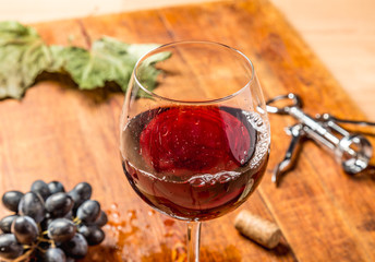 Closeup of red wine pouring in glass