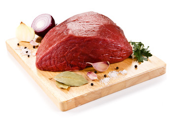Fresh raw beef on cutting board on white background 