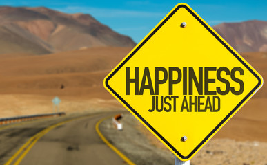 Happiness Just Ahead sign on desert road