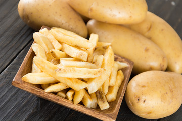 french fries on wood background