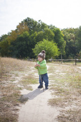 Obraz premium A boy with a stick.