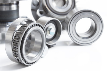 various Friction bearings lie on a gray background