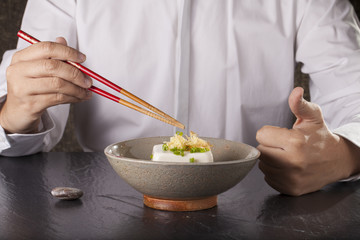 Japanese tofu, Japanese cold tofu on dining table with chopsticks and sauce