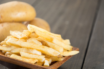 french fries on wood background