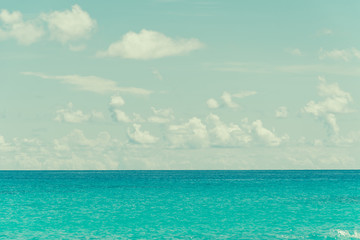 Fototapeta premium blue sky and water of ocean - vintage film filter