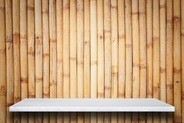 Empty top of natural stone shelves and bamboo wall background