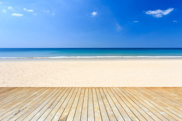 Fototapeta premium Empty top of wooden decking and view of tropical beach
