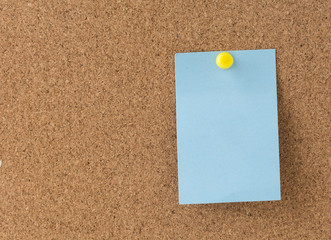 sticky note on cork board