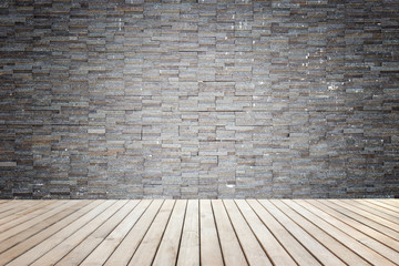 Empty top of wooden floor and natural stone wall