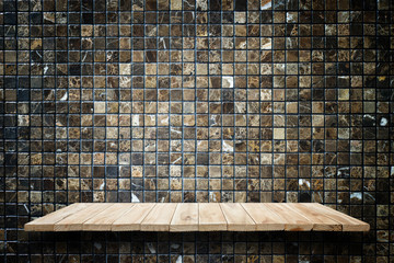 Empty wooden shelves and stone wall background. For product disp