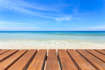 Fototapeta premium Empty top of wooden table and view of tropical beach