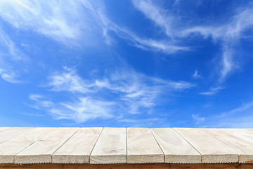 Empty top of wooden table or counter and view of tropical beach