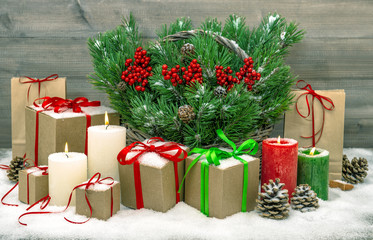 Christmas decoration with gift boxes and burning candles