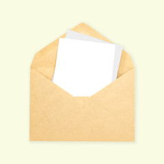Blank white paper note in brown envelope