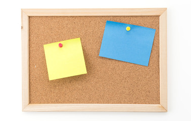 sticky note on cork board