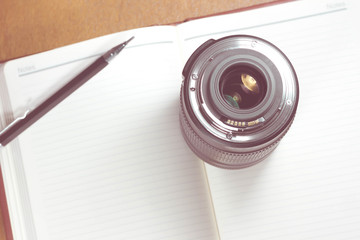 Camera photo lens on notebook ,concept photography  - Vintage ef