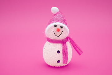 smiling toy christmas snowman on a red background