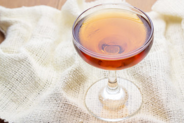 wine in glass on white fabric