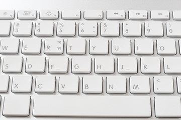 A part of desktop computer keyboard is a white color