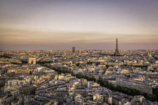 Sunset over Paris with Eiffel Tower and Arch de Triumphe