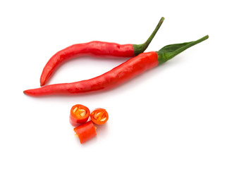 fresh and spicy cayenne with cut out sections on a white background