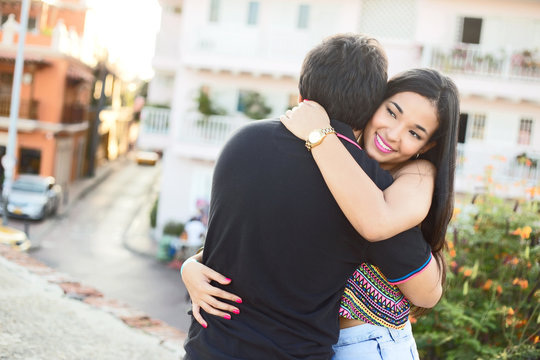 young couple hugging in the street of Cartagena, Colombia