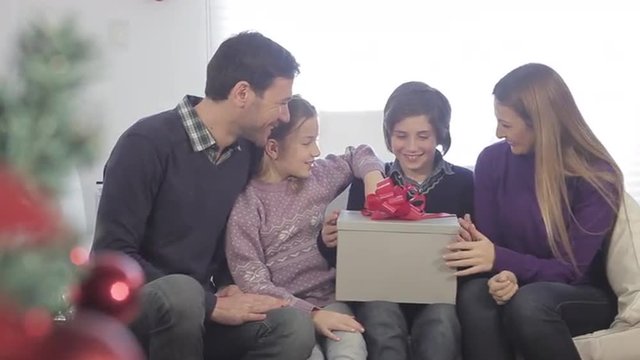 Family opening christmas presents