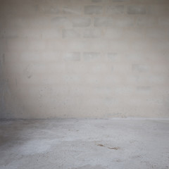 plaster mortar wall and cement floor in construction site