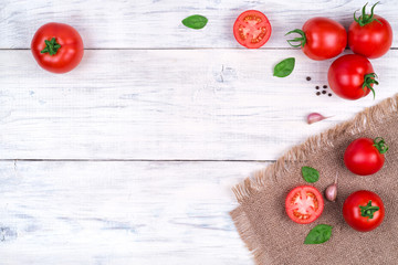 tomatoes on white wooden table, pasta ingredients top view