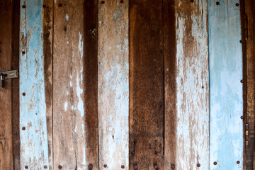 old wooden door textured with blre painted