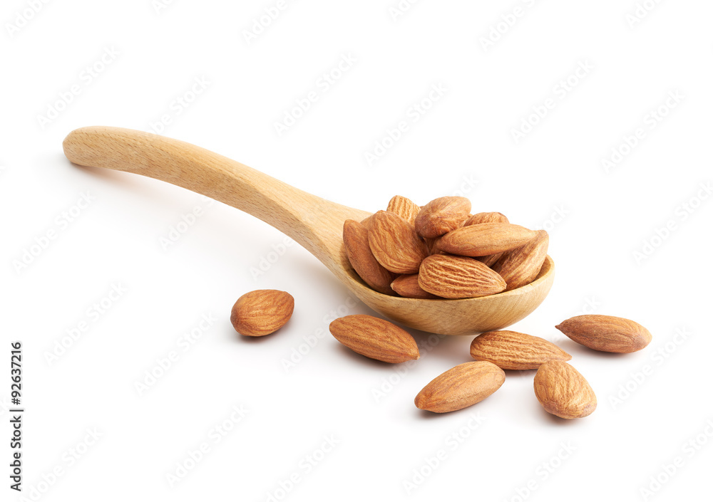 Poster almonds on wooden spoon isolated over white background - Posters