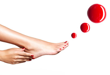 Beautiful female feet with red pedicure and nail polish - obrazy, fototapety, plakaty