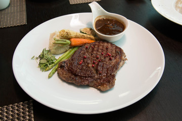 Grilled steaks with Pepper sauce and vegetables