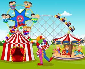 Cartoon happy children and clown in the amusement park