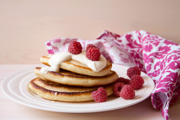 Fritters with a raspberry and sour cream
